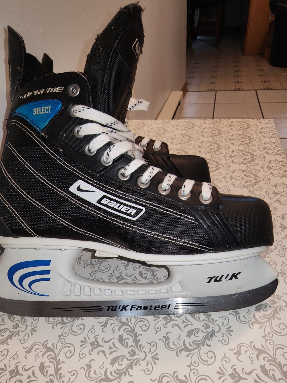 Bauer/Nike Black and White Ice Hockey Skates with Blue Accents